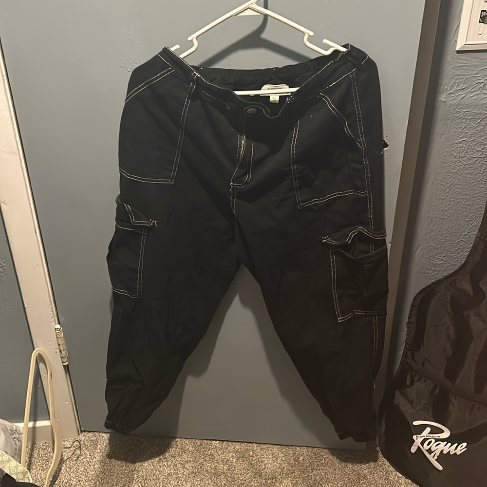 Black cargo pants with white stitching